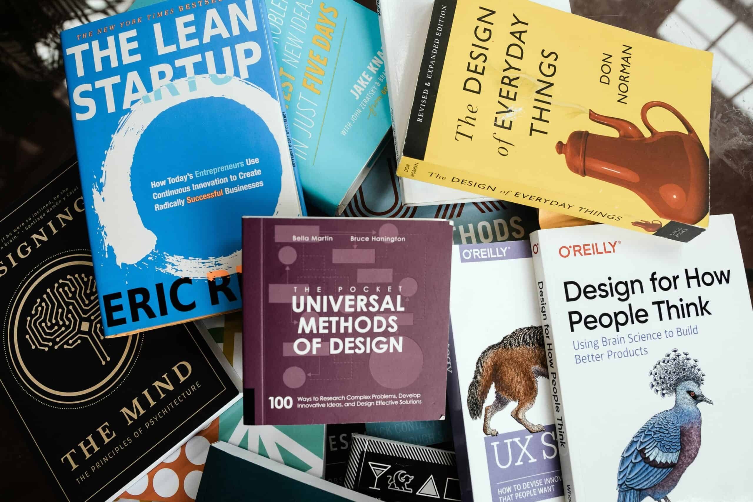 A collection of books related to user interface design and startup companies.